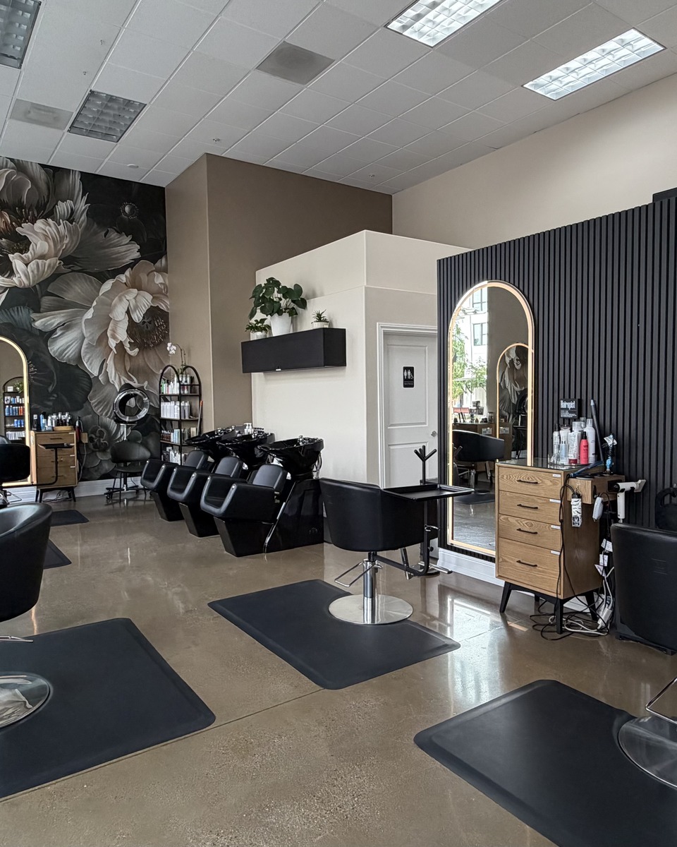 Timi's Beauty Salon interior with arched mirrors and styling stations